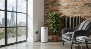 Sleek HEPA air purifier positioned in the corner of a contemporary flat in London.