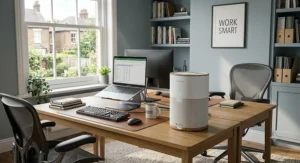 Modern, quiet air purifier operating unobtrusively next to a laptop on a wooden desk, perfect for maintaining focus during work hours.
